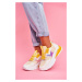 Dámske športové topánky v žlto-zlatej farbe na hrubej podrážke