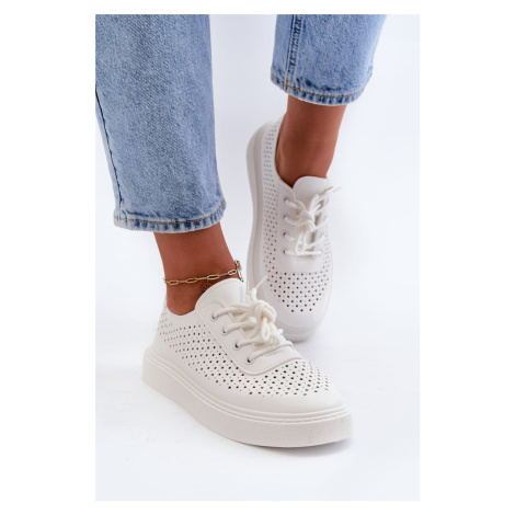 Openwork sneakers on a white Tanvi platform