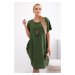 Loose dress with pockets and a pendant, light green