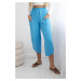 Turquoise trousers with wide legs and pockets