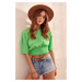 Green short blouse with a wide hem