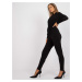 Black monochrome jumpsuit with Serafini belt