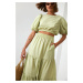 Women's summer set blouse with a skirt in light khaki color