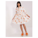 White and orange patterned dress with ruffle