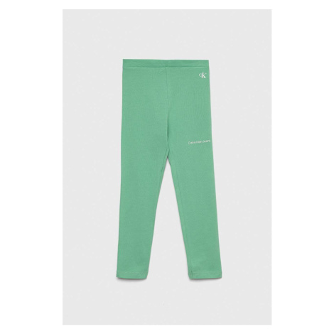 Detské legíny Calvin Klein Jeans zelená farba, s potlačou