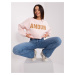 Light pink hoodie with inscription