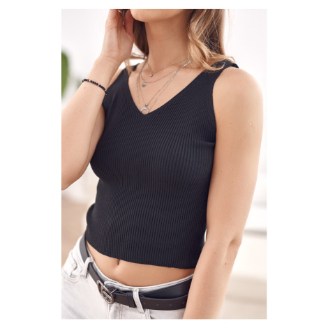 Knitted top with black V-neck FASARDI