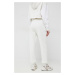 Tepláky Calvin Klein Jeans dámske, béžová farba, s potlačou