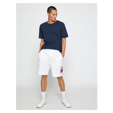 Koton Basic Sports Shorts with Asian Print with a drawstring waist and pocket.