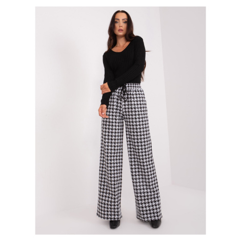 Black and white patterned fabric trousers