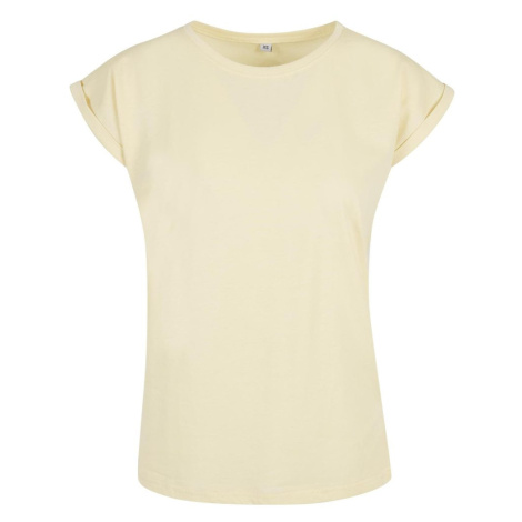 Build Your Brand Voľné dámske tričko s ohrnutými rukávmi - Jemne žltá