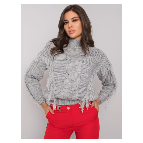 Pletený sveter s vrkočovým vzorom