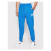 New Balance Teplákové nohavice Essentials Stacked Logo MP03558 Modrá Athletic Fit