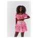 Short skirt with ruffles made of pink checkered material