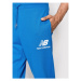 New Balance Teplákové nohavice Essentials Stacked Logo MP03558 Modrá Athletic Fit
